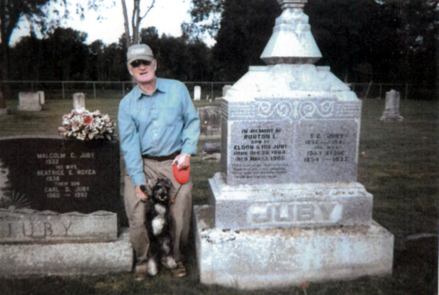Bother Malcom and dog at Juby Family gravestones in cemetery